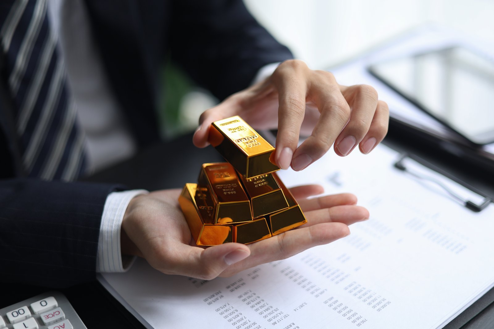 investment in gold man holding bullion in office 2026 09 25 02 17 11 utc